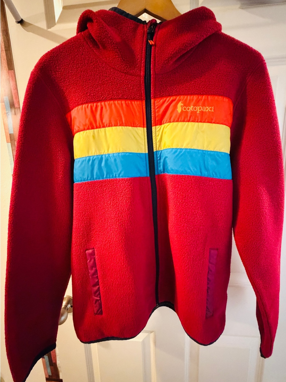 cotopaxi Red Fleece Jacket with Orange, Yellow & Blue Stripes